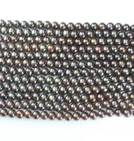 23 x Brand New Black / bronze Cultured Freshwater Pearl Loose strings 10 to 11mm size - RRP £1472 Reserve £468
